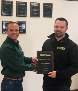 Erik Flood, of Krone North America, presents the #1 Retail Sales Volume Dealer Award to Ryan Vandenberg of Noble Equipment, Nobleford, Alberta, Canada. 