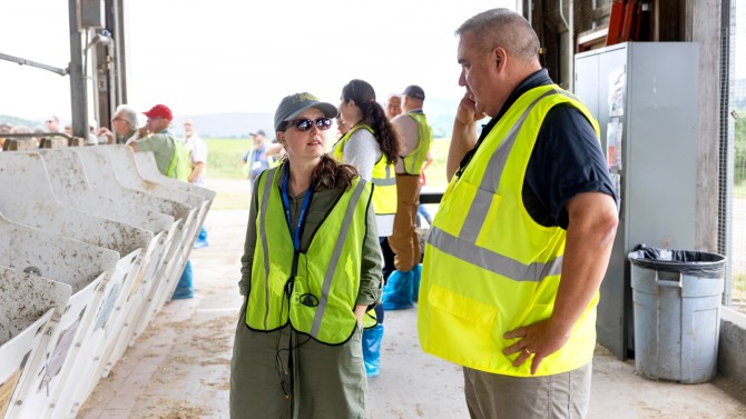 Katie Howard (left), deputy commissioner for the New York State Department of Agriculture and Markets, talks with Thomas Overton, director of Cornell CALS PRO-DAIRY and professor of animal science in the College of Agriculture and Life Sciences, at a June 30 event showcasing the Cornell University Ruminant Center.